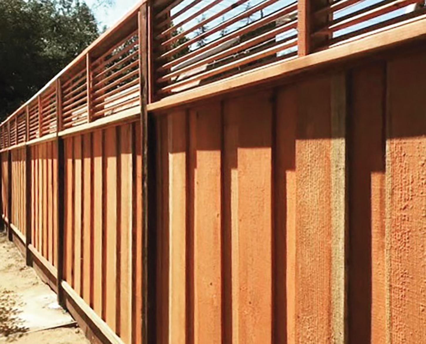 Picture of Guy's Fencing’s signature product is a board-on-board fence with custom louvers. - Guy's Fencing