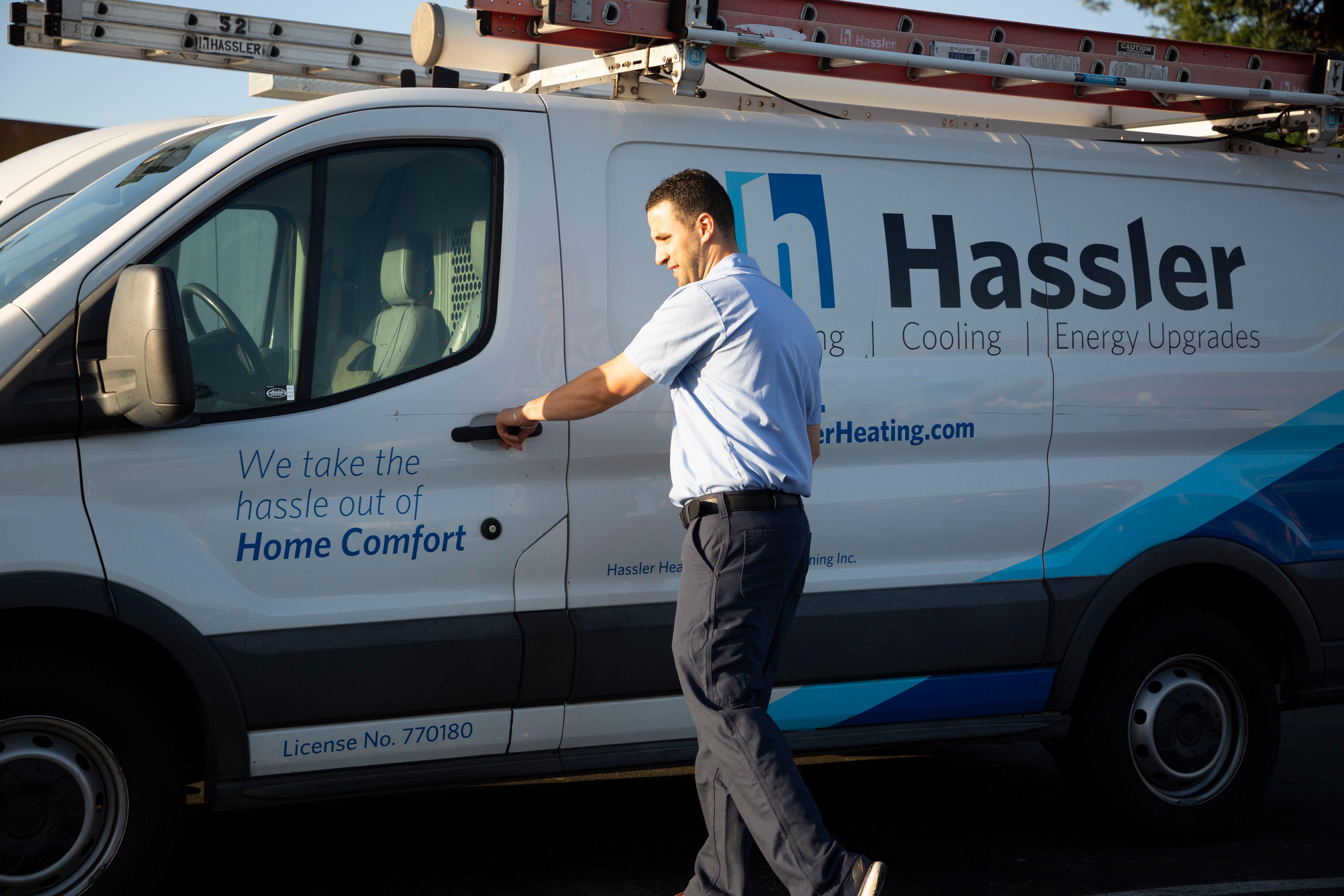 Picture of A Hassler technician heads to a jobsite. - Hassler Heating & Air Conditioning, LLC
