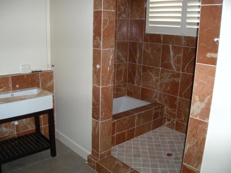 Picture of DC Tile and Stone used red marble to create this custom guest shower. - DC Tile and Stone