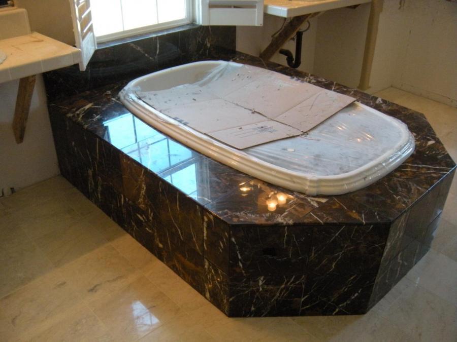 Picture of DC Tile and Stone installed this black and gold marble tile tub surround. - DC Tile and Stone