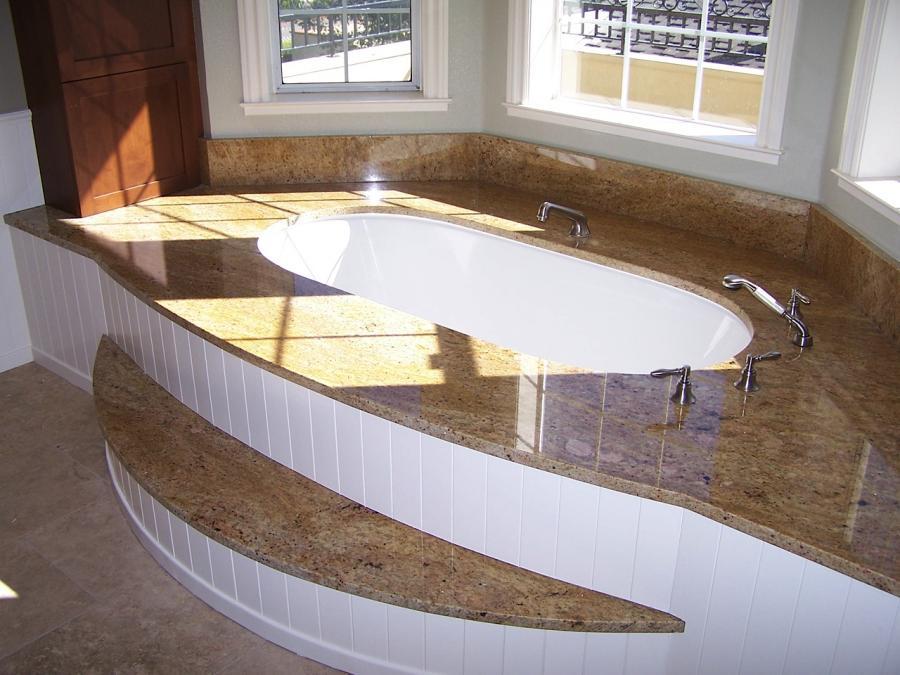Picture of Under-mount tub granite deck and step with poplar wainscoting. - Labourdette Construction