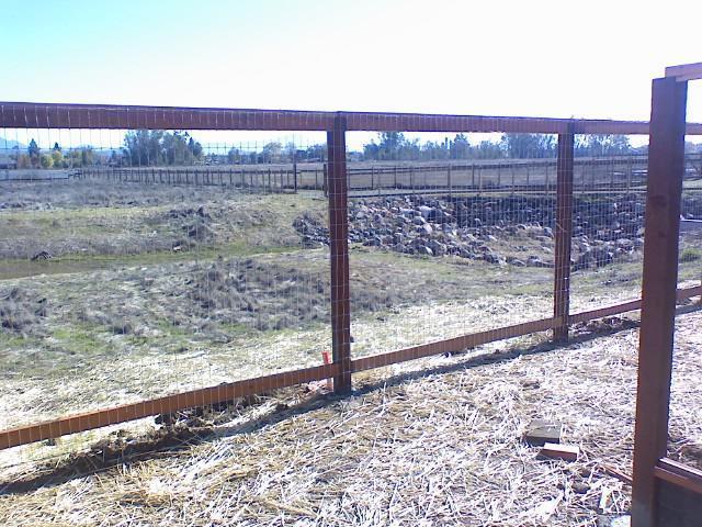 Picture of This rail-wire fence keeps pets in and deer out. - Redwood Residential Fence Company