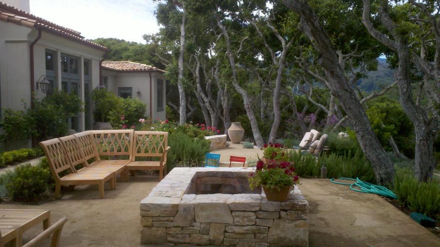 Picture of An outdoor entertaining space with a natural stone fire pit - Jerry Allison Landscaping, Inc.