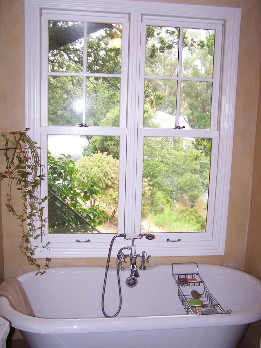 Picture of Claw foot tub with vintage fixture Marvin window. - Labourdette Construction