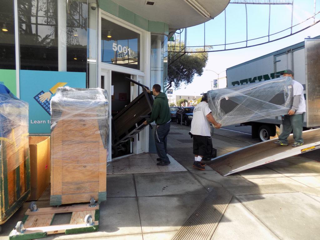 Picture of A and P Moving technicians move a client's office to its new location. - A and P Moving, Inc.
