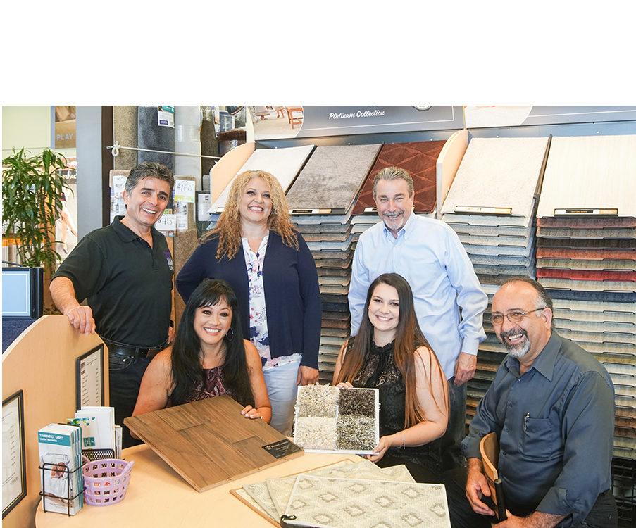Picture of City Carpets' staff members educate customers about their flooring choices. - City Carpets