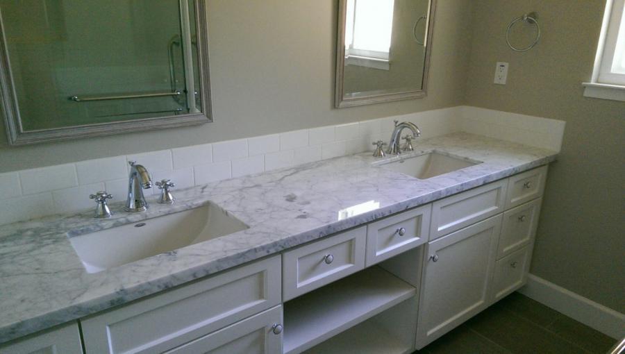 Picture of Devengenzo Landscaping & General Engineering installed custom white cabinets with double sinks in this child-friendly bathroom. - Devengenzo Landscaping & General Engineering Inc.