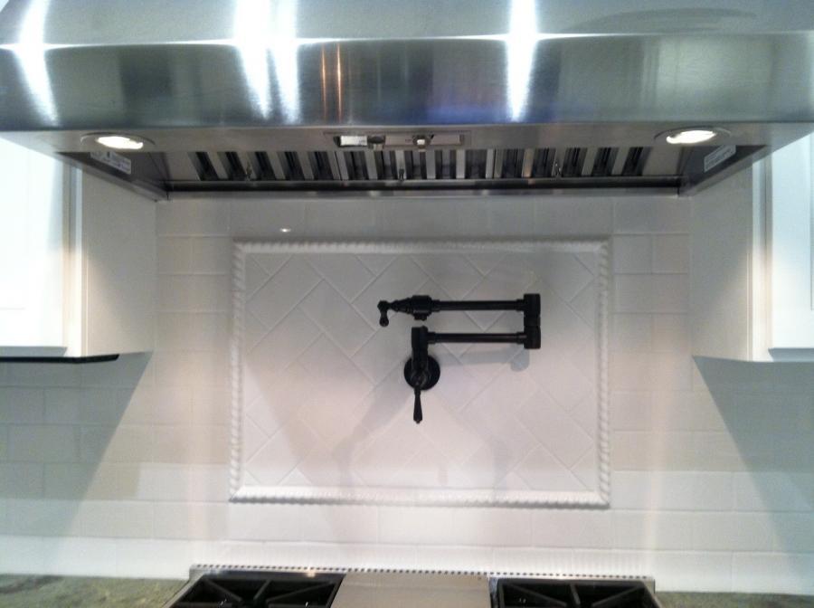 Picture of This kitchen remodel features white subway tile as back splash. - Devengenzo Landscaping & General Engineering Inc.