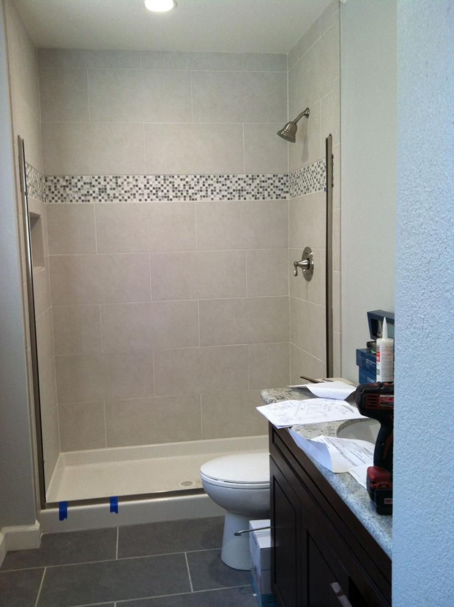 Picture of Devengenzo Landscaping & General Engineering added glass mosaic tiles to this shower to complement the porcelain floor tiles. - Devengenzo Landscaping & General Engineering Inc.