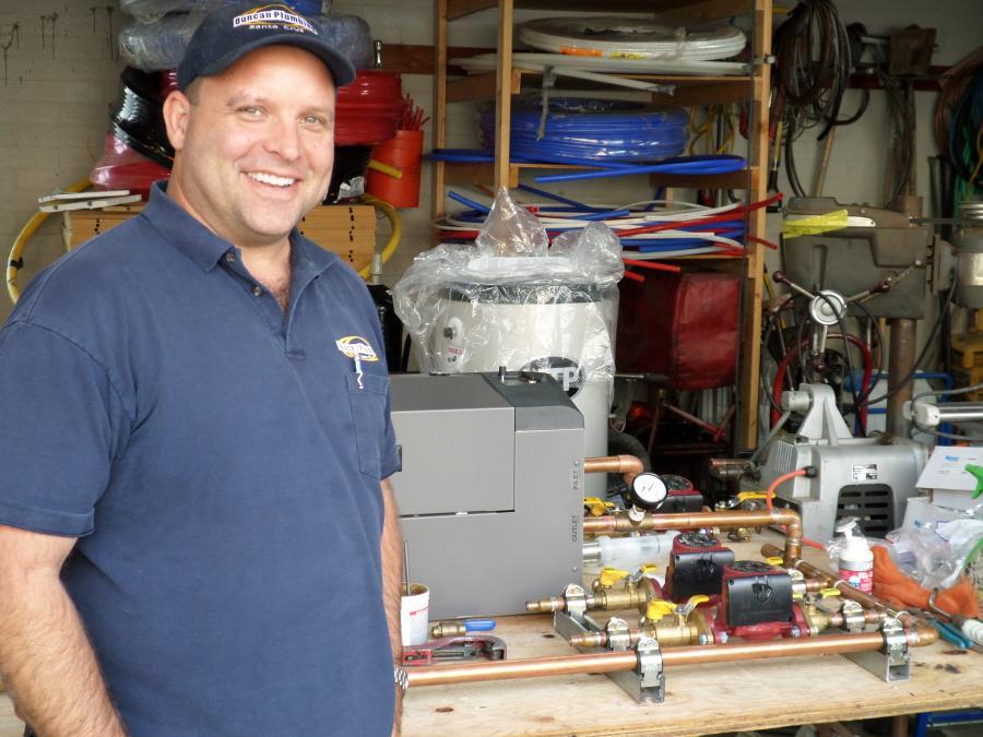 Picture of Owner Scott Duncan works on a custom boiler. - Duncan Plumbing Ent., Inc.