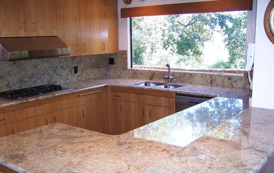Picture of Book-matched oak veneer cabinet refacing granite counters. - Labourdette Construction