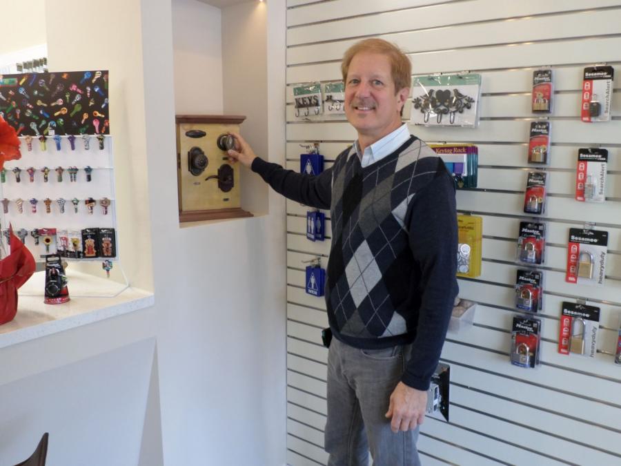 Picture of Owner Gary Lekan demonstrates a display piece. - First Lock & Security Technologies