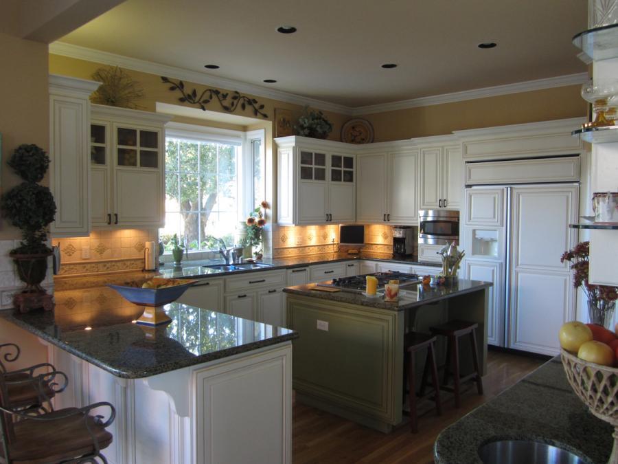 Picture of These painted finish cabinets feature glass inserts. - Century Cabinets