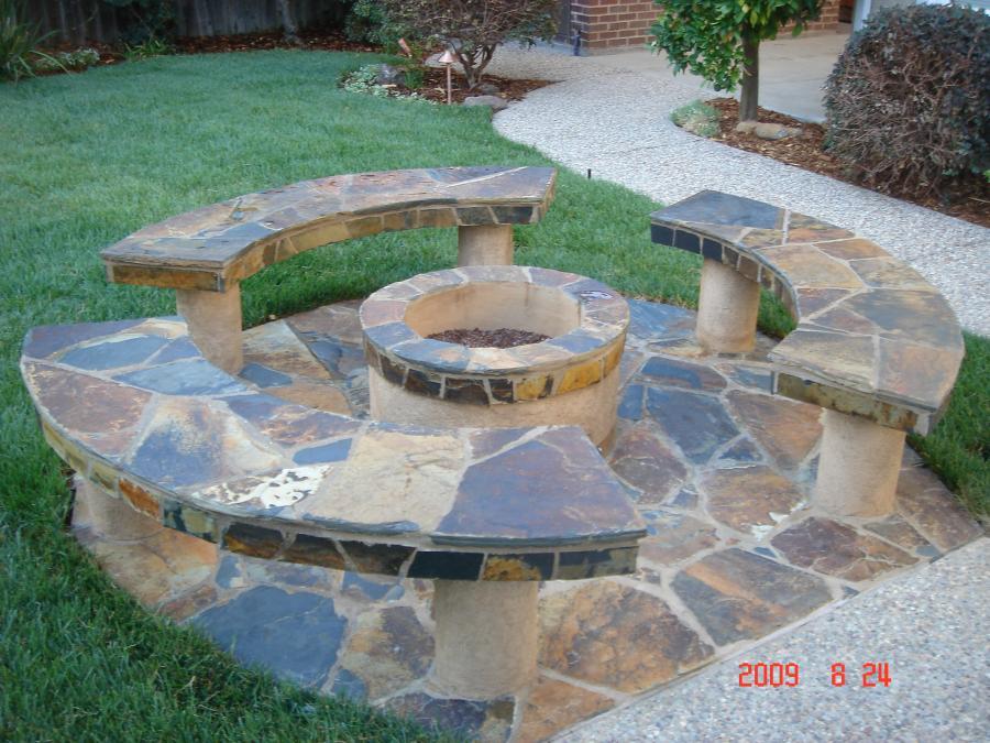 Picture of A small fire pit with three custom-built benches covered with flagstones in Walnut Creek - Pacific Landscaping