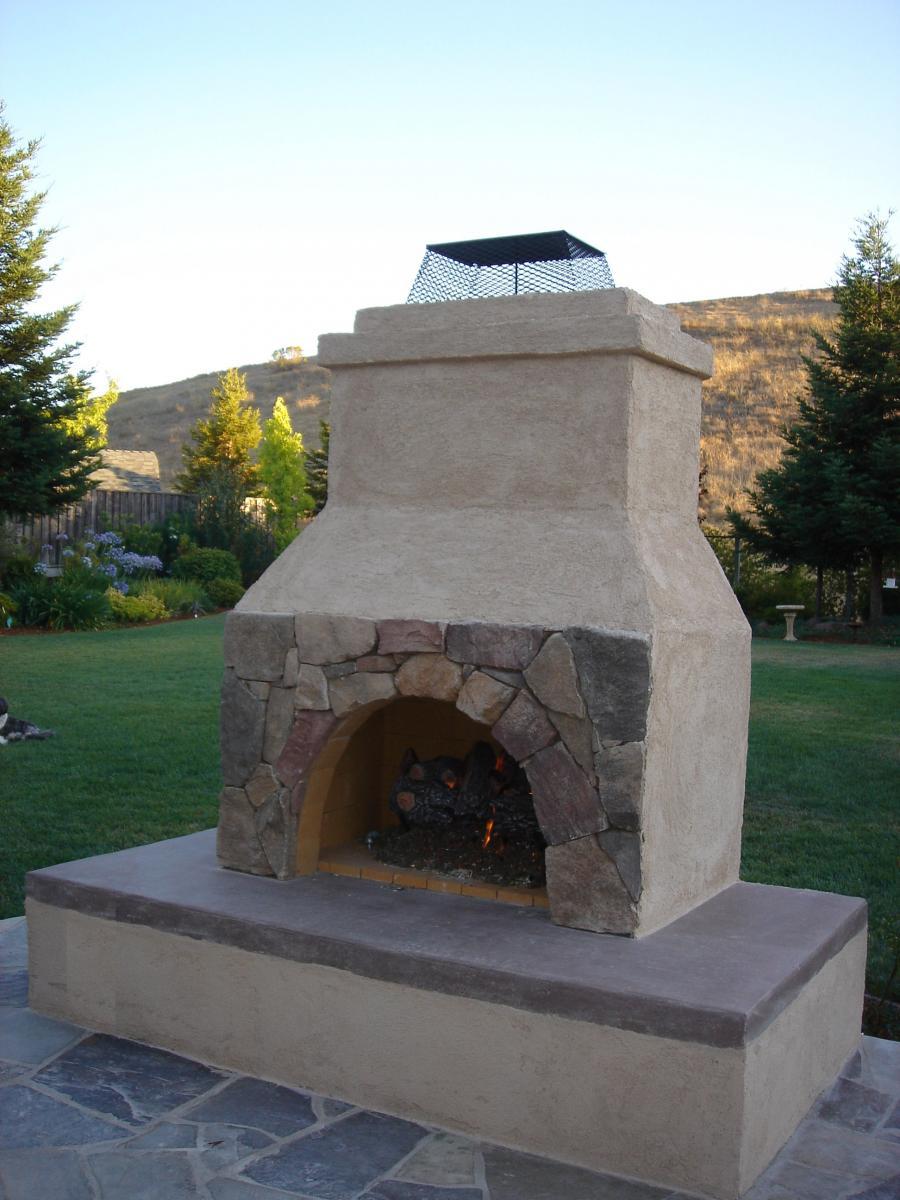 Picture of Pacific Landscaping built this stucco/flagstone fireplace with a sitting area. - Pacific Landscaping