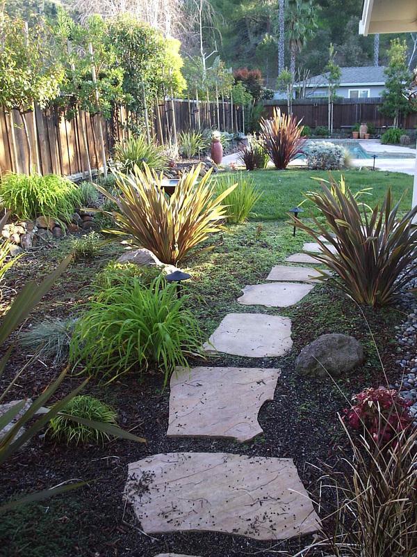 Picture of Natural Landscaping Contractors installed stepping stones and drought-tolerant plants in this Walnut Creek yard. - Natural Landscaping Contractors