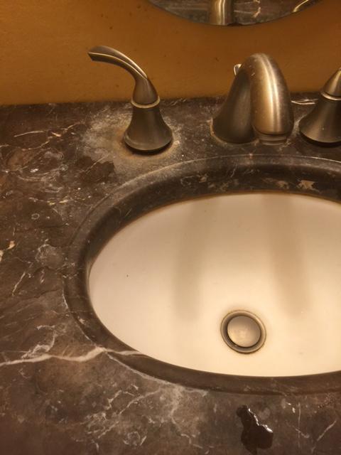 Picture of A "before" shot of a recent faucet cleaning job - Optimum Cleaning Services