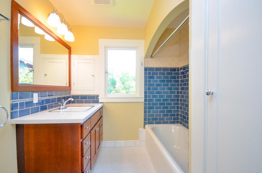 Picture of This bathroom remodeling project features tilework a bathtub lighting plumbing and additional closet space. - Home Healing Renovations Inc