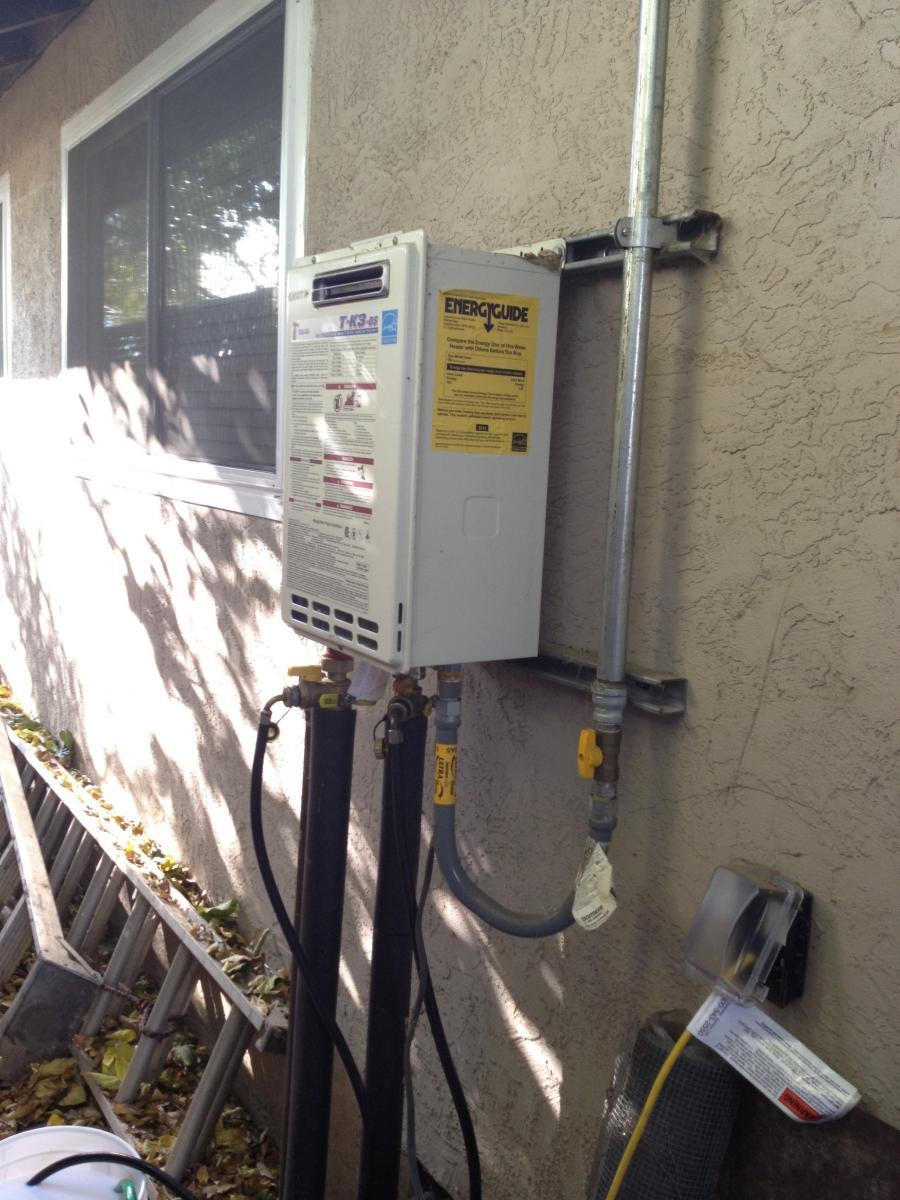 Picture of A recent tankless water heater installation on the exterior of a home in Pleasanton - Savior Plumbing, Inc.