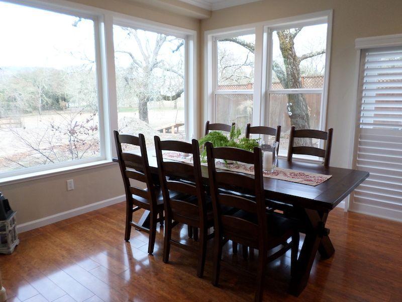 Picture of This dining room addition replaced a covered porch and brought natural sunlight into the dining room kitchen and living room. - Thompson Construction, Inc.