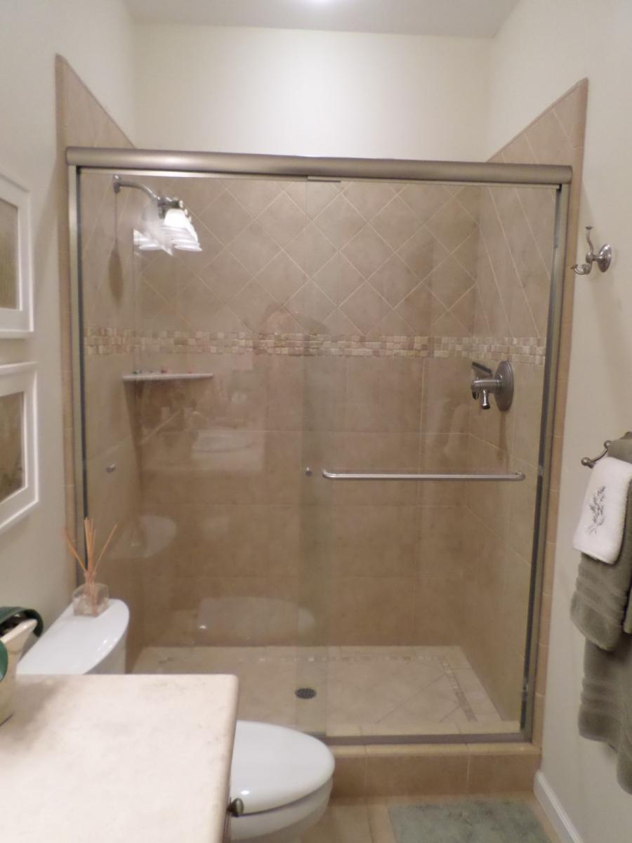Picture of Thompson Construction placed this shower's controls at the opposite end of the shower head for maximum convenience. - Thompson Construction, Inc.
