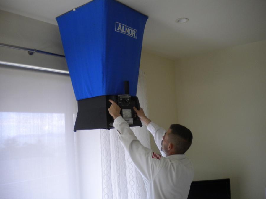 Picture of Checking the Air Flow with a Flow Hood - A-1 Guaranteed Heating & Air, Inc.