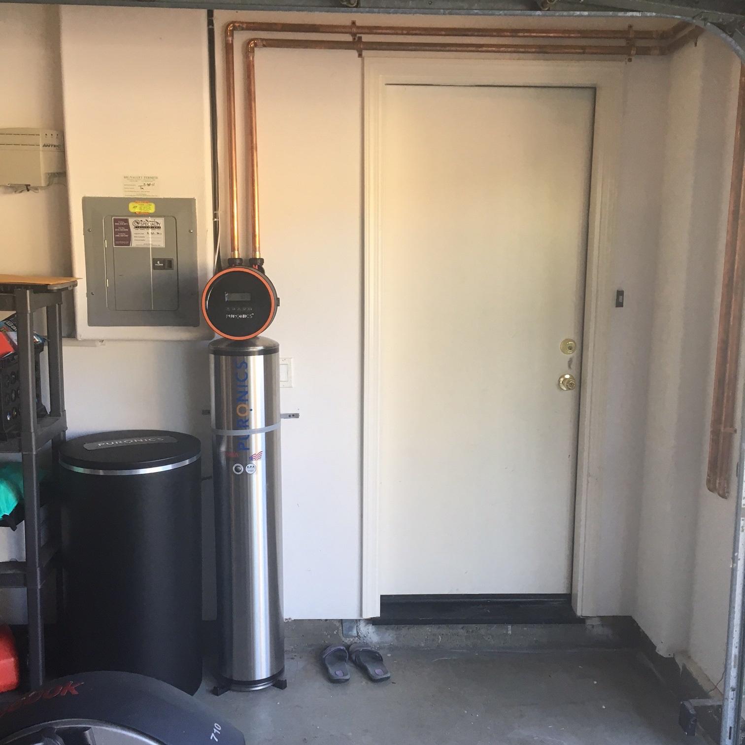 Picture of This Terminator® water treatment system is designed to remove the taste and odor of chlorine inhibit the growth of bacteria and remove water hardness throughout the entire house. - Puronics, LLC