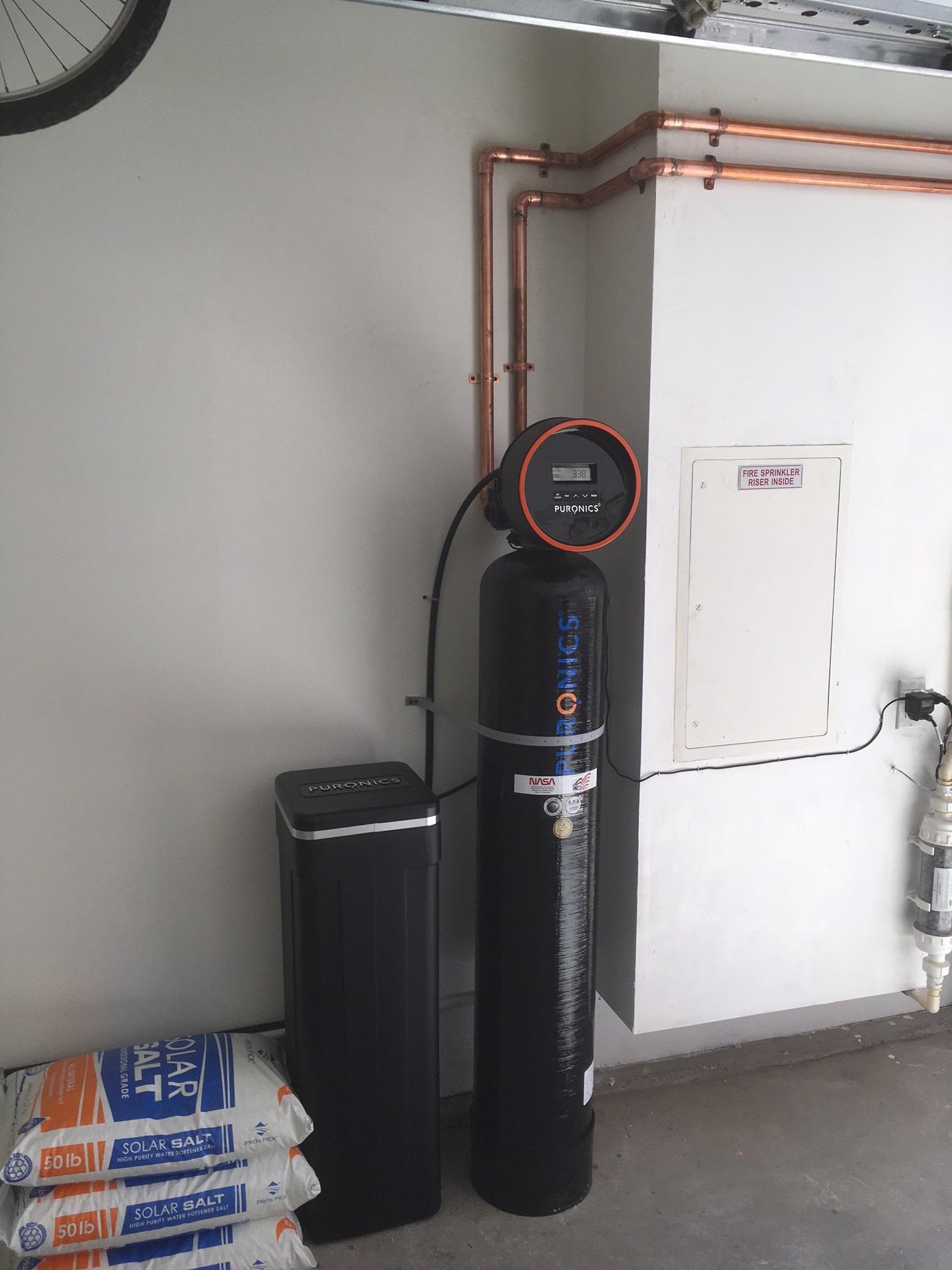 Picture of Puronics installed this Defender® whole-house water treatment system with a fiberglass tank in a customer's home. - Puronics, LLC