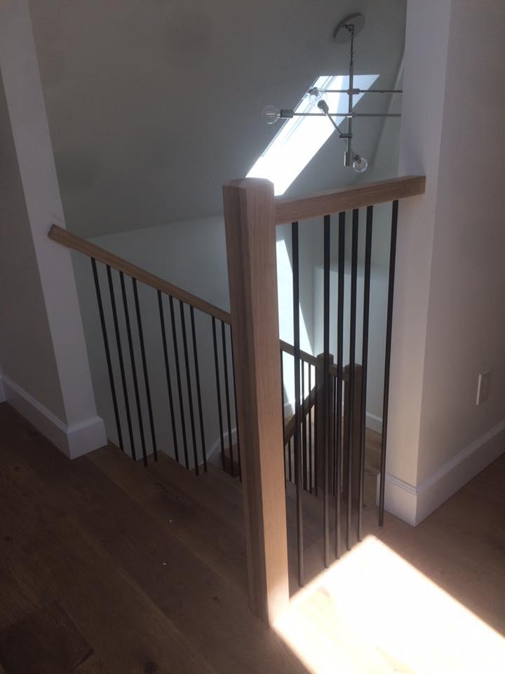 Picture of Martinez Stair Company Inc. installed square newel posts and railings with straight metal balusters to give this Berkeley home a custom contemporary look. - Martinez Stair Company Inc.
