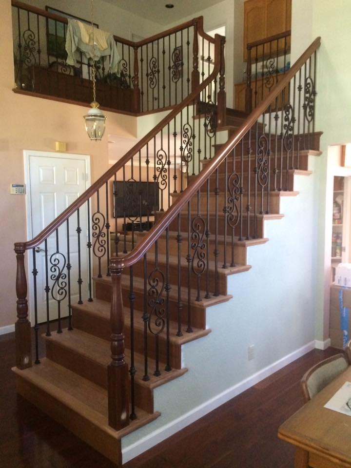 Picture of An additional view of this Danville home shows how turned wood posts and metal balusters combine to create a more ornate appearance. - Martinez Stair Company Inc.