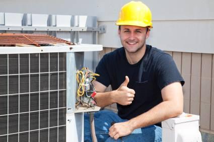 Picture of One of Air Quality Heating & Air Conditioning's highly trained technicians prepares to start a job. - Air Quality Heating & Air Conditioning, Inc.