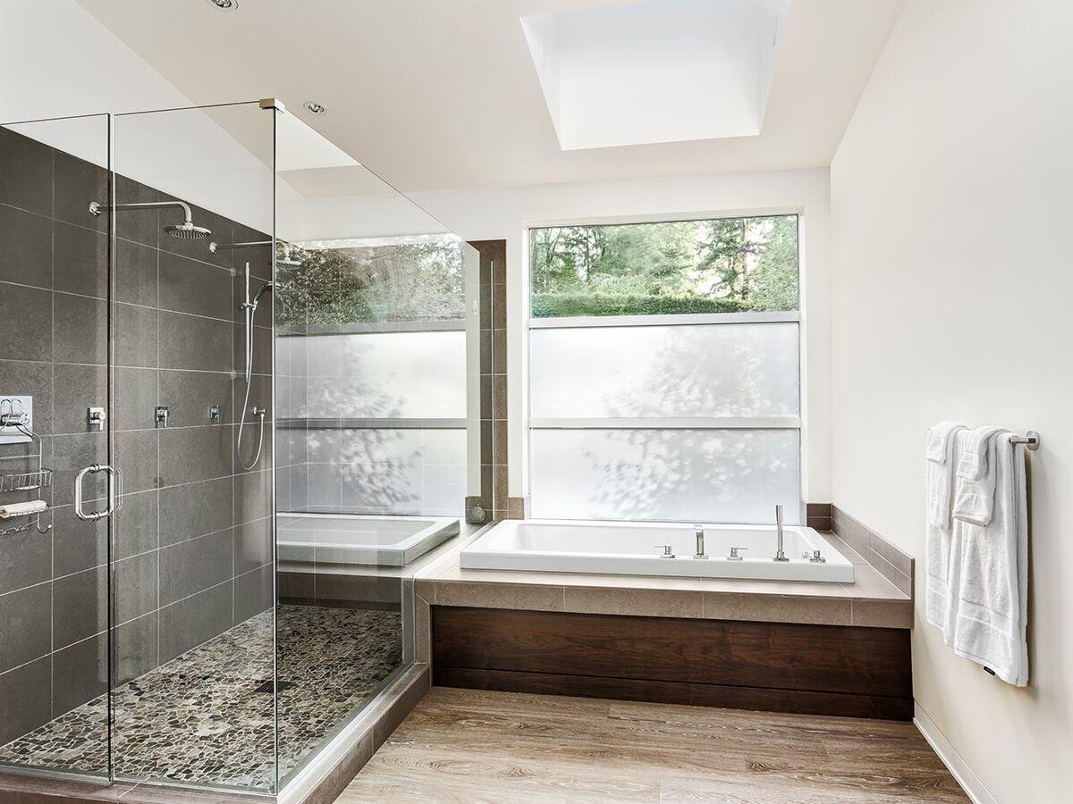Picture of Schicker Luxury Shower Doors manufactured this frameless shower door to allow maximum light in the shower and make the bathroom feel larger. - Schicker Luxury Shower Doors, Inc.