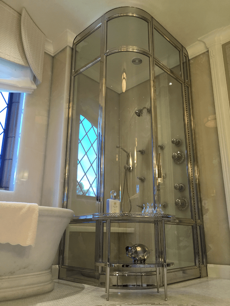 Picture of Schicker Luxury Shower Doors custom designed this Peninsula Brass shower enclosure with rounded glass and brass. The company worked with an architect to develop the customer's vision. - Schicker Luxury Shower Doors, Inc.
