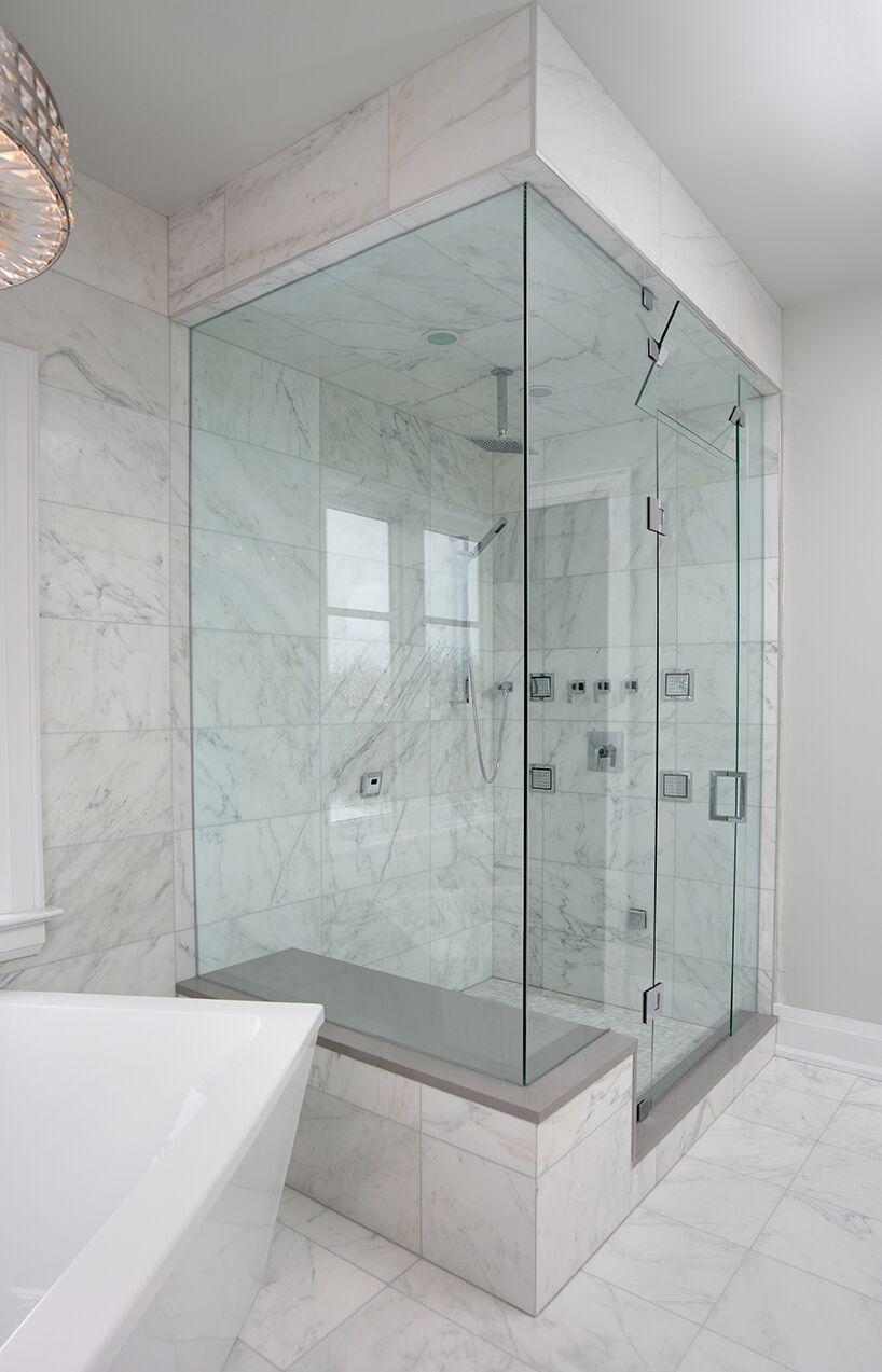 Picture of Schicker Luxury Shower Doors added glass on both sides of this corner frameless shower door to make the bathroom feel larger. - Schicker Luxury Shower Doors, Inc.