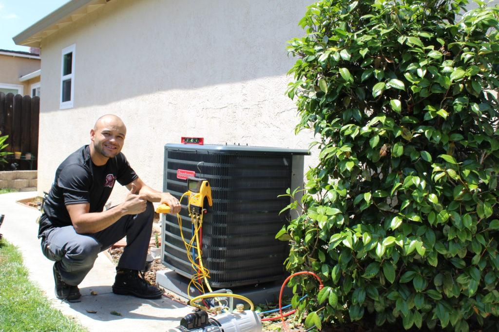 Picture of Lead Install Technician Gilbert Caceres installs a new HVAC system in Antioch. - Perfect Star Heating and Air Conditioning