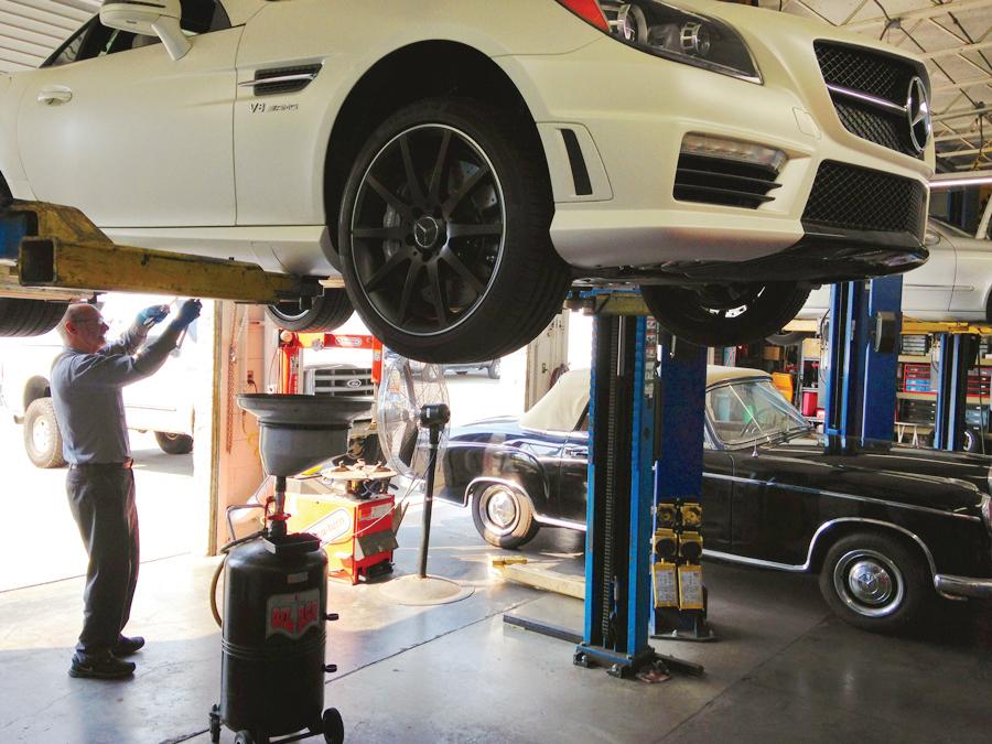 Picture of A European Sales & Service technician works on a customer's SLK55 AMG. - European Sales & Service