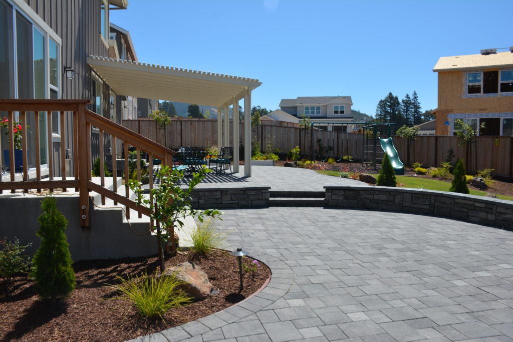 Picture of This paver patio features a custom ledgestone wall and new gardens. - Manzanita Landscape Construction, Inc.