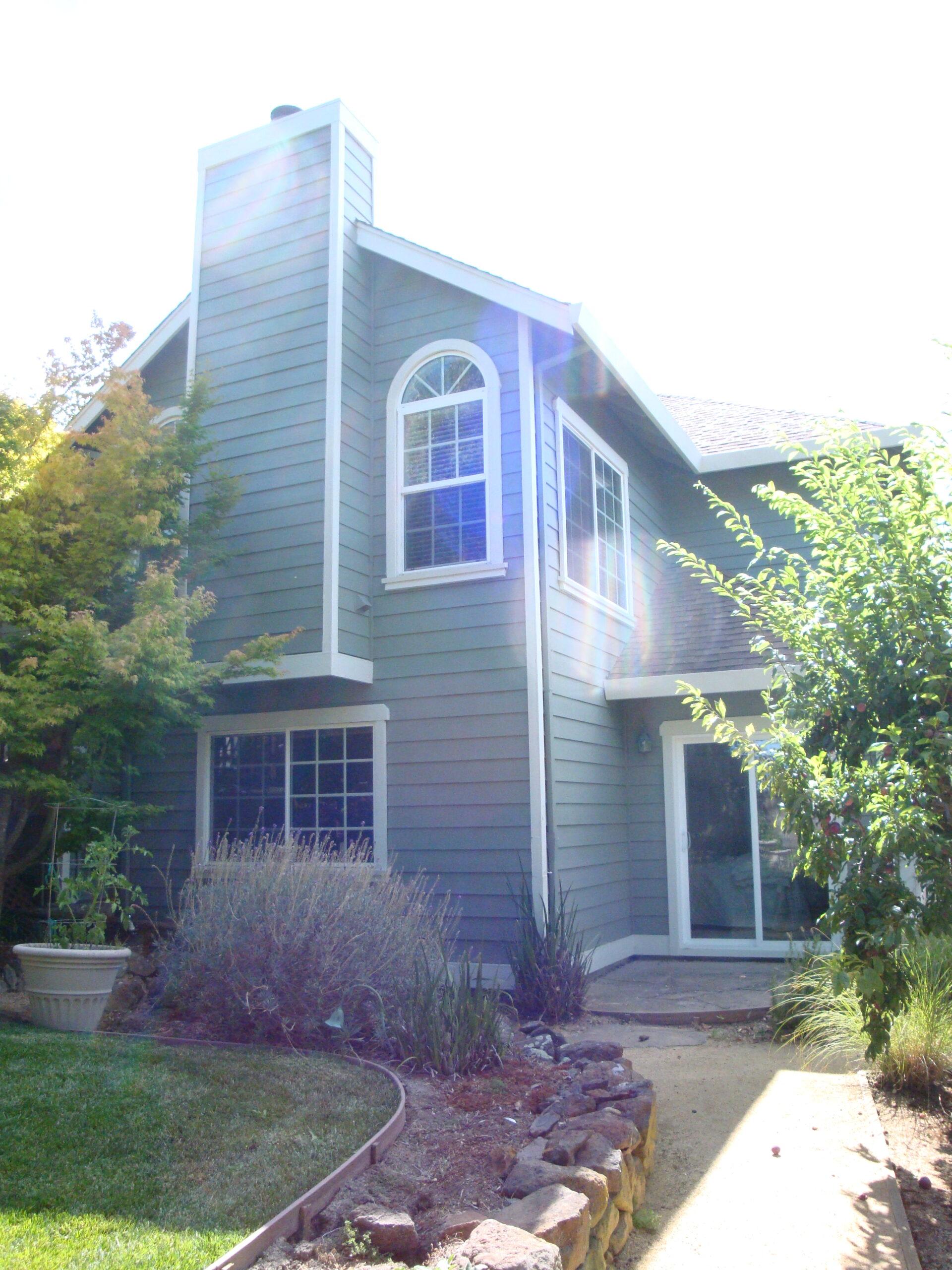 Picture of This Petaluma home has a mix of slider and double-hung windows with some accent eyebrows. All retrofit vinyl is from Simonton. - Save Energy Company