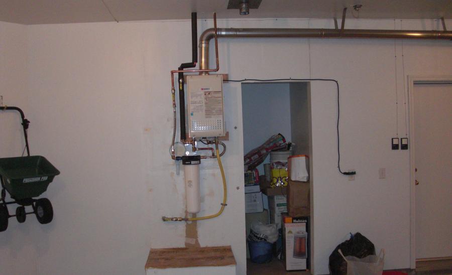 Picture of Compact tankless installations help preserve garage space. - Water Heaters Masters Inc.