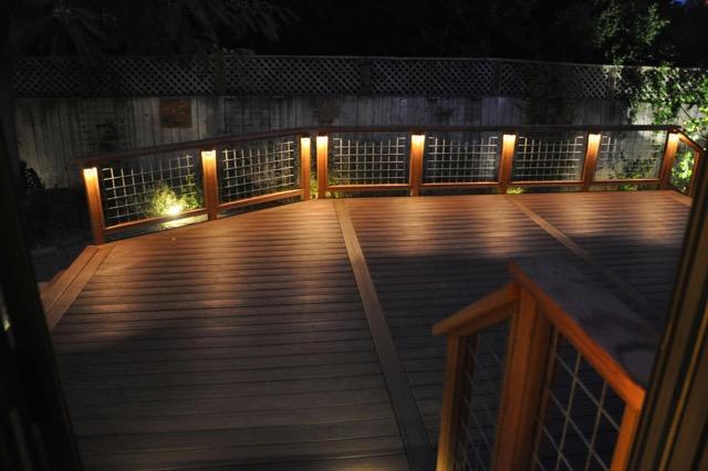 Picture of This Ipe decking features redwood and hog wire rails and low-voltage lighting. - Farrar Construction Inc.