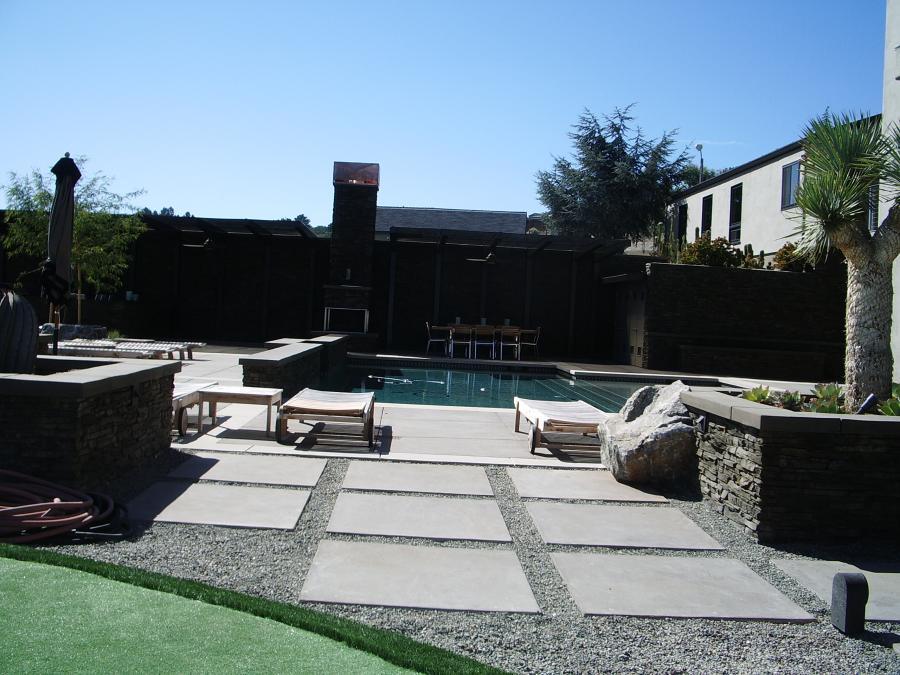 Picture of This backyard swimming pool area in Carmel features clean lines and low-maintenance plants. - Jerry Allison Landscaping, Inc.