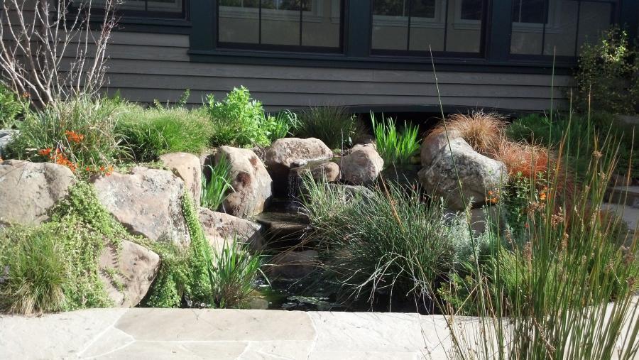 Picture of This creek and pond provide natural ambiance for a home's front entry. - Jerry Allison Landscaping, Inc.