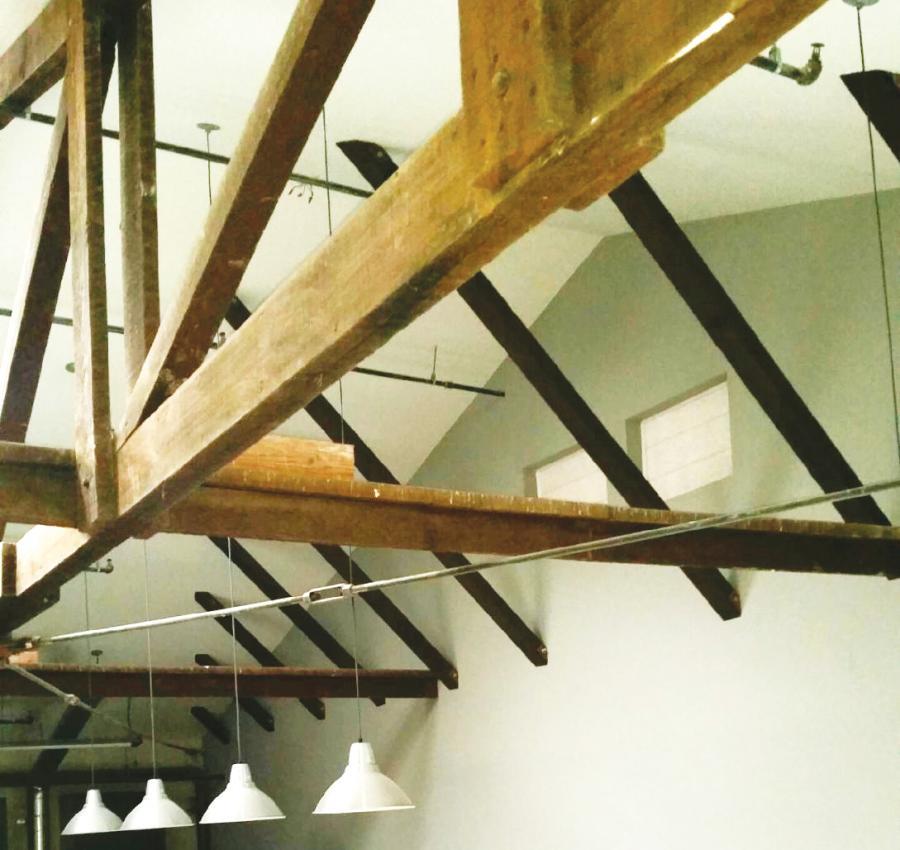 Picture of Kapple Drywall installed drywall around these high ceiling beam braces at a construction office in Petaluma. - Kapple Drywall