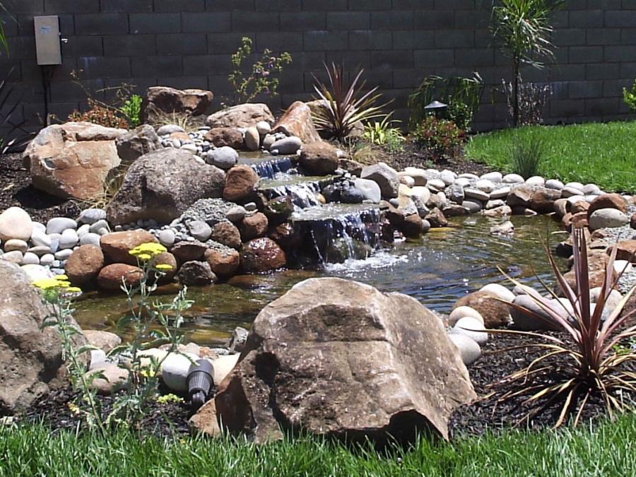 Picture of Natural Landscaping Contractors installed this waterfall in a client's yard. - Natural Landscaping Contractors