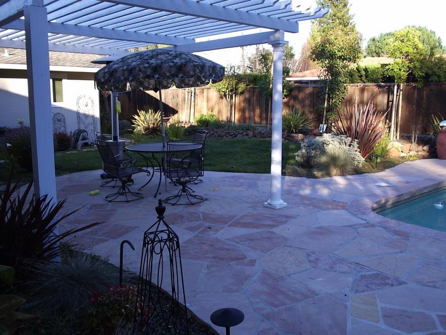 Picture of This landscaping project in Walnut Creek features a small seating area that overlooks a pool. - Natural Landscaping Contractors