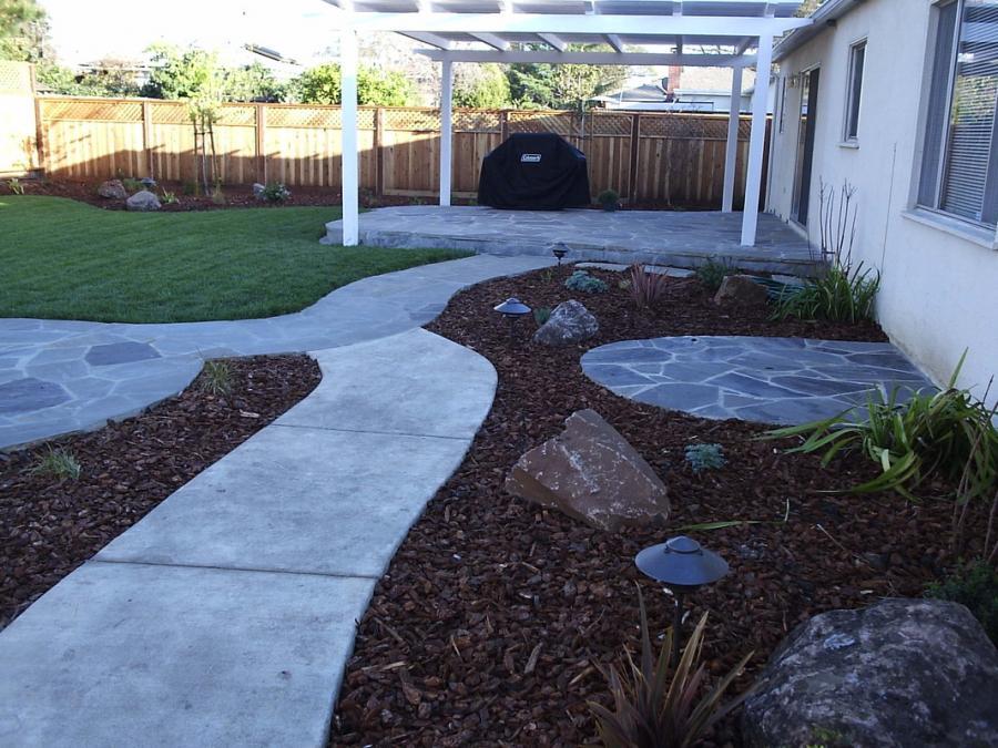 Picture of This project in Concord features three different seating areas an arbor a flagstone patio and a couple of walkways. - Natural Landscaping Contractors