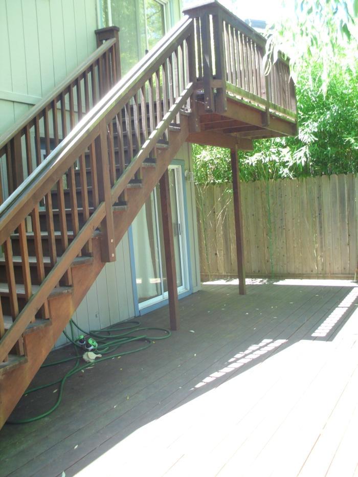 Picture of This 600-square-foot Trex deck features an overhead balcony that provides a view of a creek. - Thomas A Daly Construction