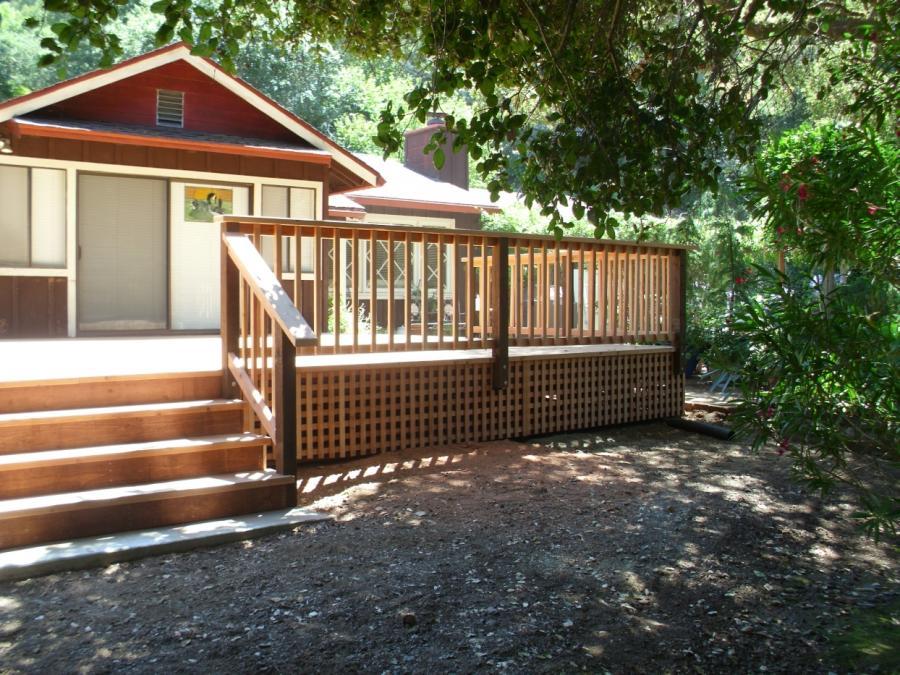 Picture of Deck and stair railings complete this redwood deck project. - Thomas A Daly Construction