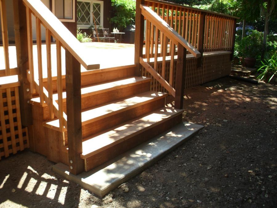 Picture of Three stairs connect this redwood deck to the garden level. - Thomas A Daly Construction