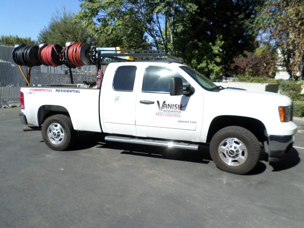 Picture of One of Vanish Integrative Pest Control's service vehicles on a recent jobsite - Vanish Integrative Pest Control, Inc.